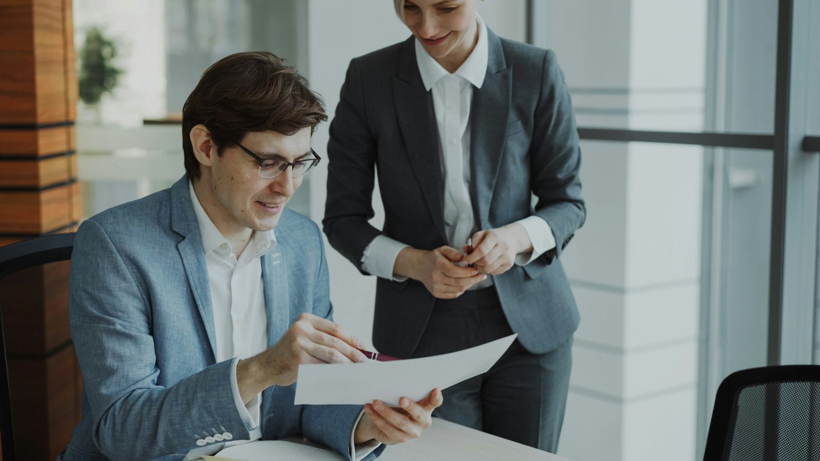 Professionals discussing documents together at a table